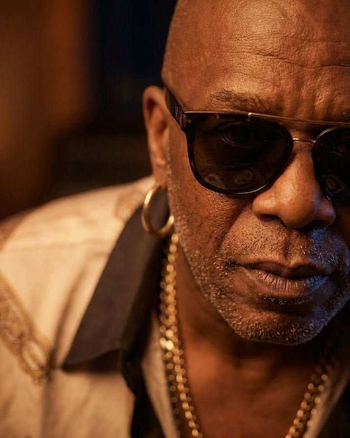 Hank Morrison, close up, dark glasses and a gold chain